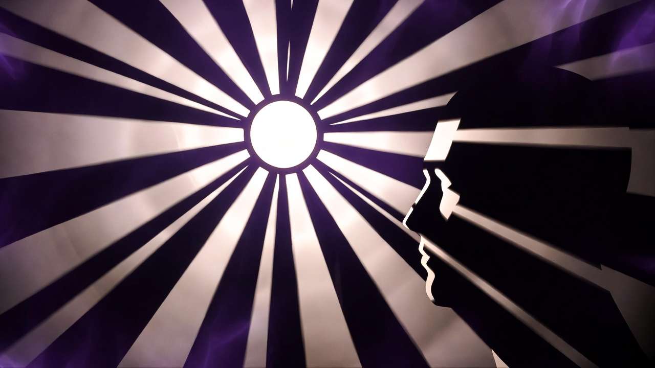 Head silhouette in profile toward sunburst light